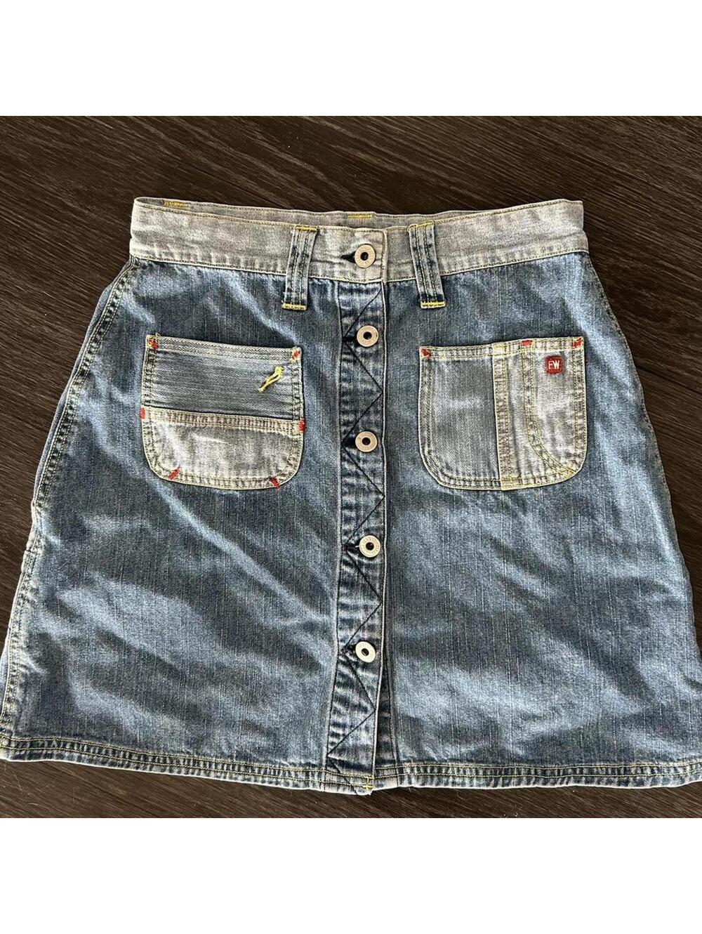 Forewarned denim skirt with button up front and pockets.